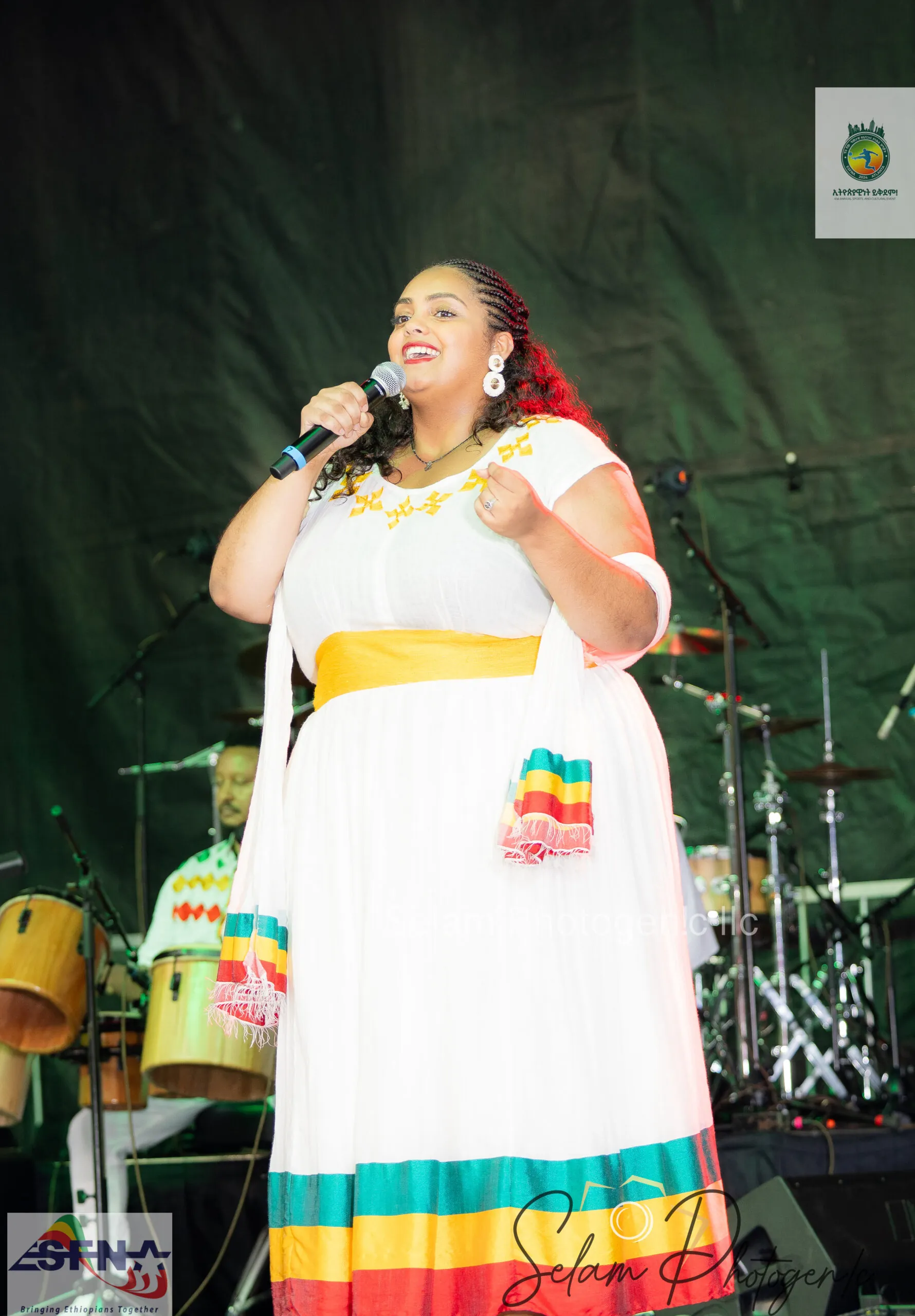 A singer in traditional dress on stage