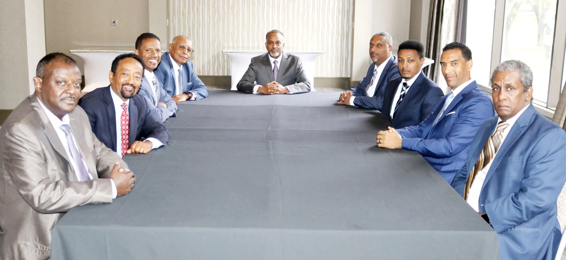Members of the Executive Committee seated around a meeting table